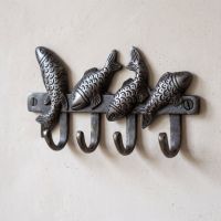 The Swimming Fish 4-Hook Coat Rack in Cast Antique Iron - 170mm on a Cream Coloured Wall - Digital Illustration