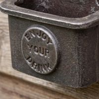 The Tavern "Enjoy Your Drink" Cast Iron Bottle Cap Catcher Showing a Close up of the Enjoy your Drink Text