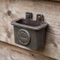 The Tavern "Enjoy Your Drink" Cast Iron Bottle Cap Catcher Shown on a Wooden Clad Wall - Digital Illustration 