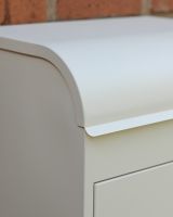 The "Titan" Medium Wall Mounted Parcel Box Steel in Cream Showing a Close up of the Curved Lid