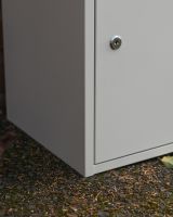 The "Titan" Medium Wall Mounted Parcel Box Steel in Cream Showing a Clsoe up of the Locking Mechanism