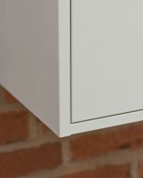 The "Titan" Medium Wall Mounted Parcel Box Steel in Cream Showing the Corner of the Parcel Box