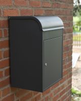 The "Titan" Medium Wall Mounted Parcel Box Steel in Grey Shown at an Angle Mounted onto a Brick Wall