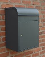 The "Titan" Medium Wall Mounted Parcel Box Steel in Grey Shown Mounted onto the Side of a Brick Wall