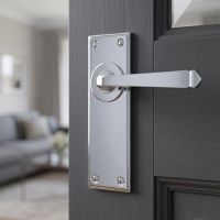The Valen Lever Latch Door Handle Set in Polished Stainless Steel on a Grey Door leading to a Modern Living Room - Digital Illustration