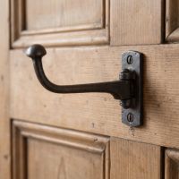 The Victorian Cast Iron Swivel Coat and Wardrobe Hook on the Back of a Timber Door - Digital Illustration