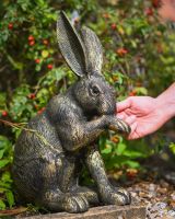 The Whiskers the Grooming Hare Garden Statue with Hand in Shot for Scale