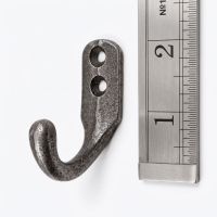 The Yorkshire Single Robe Hook in Cast Antique Iron - 50mm On a White Background  by a Ruler for Scale - Digital Illustration
