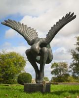 The Zephyr Winged Angel Garden Sculpture as a Centrepiece on a Garden Lawn