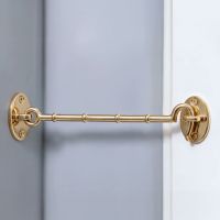 The 12 inch Brass Cabin Hooks Loose Ring Type Mounted on a Grey Wall Holding Open a Door - Digital Illustration