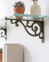 The 12 x 21cm "Luciano" Ornate Scroll Bracket Mounted on a White Coloured Wall Supporting a Glass shelf - Digital Illustration The 12 x 21cm "Luciano" Ornate Scroll Bracket Mounted on a White Coloured Wall Supporting a Glass shelf - Digital Illustration