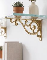 The 12 x 21cm "Luciano" Ornate Scroll Brass Wall Bracket Mounted on a White Wall in a Modern Home Shown from the Side - Digital Illustration The 12 x 21cm "Luciano" Ornate Scroll Brass Wall Bracket Mounted on a White Wall in a Modern Home Shown from the Side - Digital Illustration