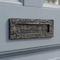 The 13" Traditional Black Iron Simplistic Door Letter Plate on a Light Blue Coloured Door on the Front of a Home - Digital Illustration The 13" Traditional Black Iron Simplistic Door Letter Plate on a Light Blue Coloured Door on the Front of a Home - Digital Illustration