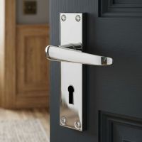 The 150mm Keyhole Victorian Straight Lock Door Handle in Polished Chrome Placed in a Traditional Entrance Hallway - Digital Illustration 