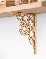 The 17 x 13cm “Harrison” Brass Wall Bracket Mounted on a White Contemporary Living Room Wall - Digital Illustration 