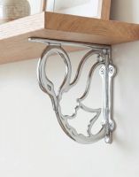 The 17cm x 20cm "Coscoroba" Bright Chrome Swan Shelf Bracket Mounted on a Contemporary Living Room Wall - Digital Illustration 