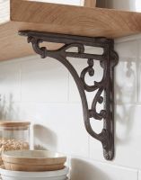 The 18 x 18cm Cast Iron Ornate Shelf Bracket Mounted on a Wooden Shelf in a Modern Tiled Kitchen - Digital Illustration 