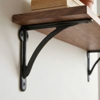 The 18 x 25cm "Bowfell" Beeswax Curved Iron Shelf Bracket on a DIY Shelf in a Modern Home - Digital Illustration 