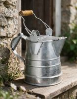 The 1 Gallon Galvanised Buckby Traditional Style Watering Can Shown on a Rustic Window Ledge Outside - Digital Illustration