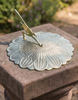 The 200mm Polished Brass "Sunflower" Sundial on top of a Traditional Stone Plinth in a Heritage Garden - Digital Illustration