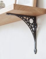 The 20cm x 22cm "Iron Bridge" Shelf Bracket Mounted on a Wooden DIY shelf in a Living Room Interior - Digital Illustration