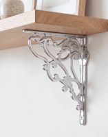 The 21 x 19cm Art Nouveau Bright Chrome Shelf bracket Mounted on a White Coloured Living Room Wall - Digital Illustration The 21 x 19cm Art Nouveau Bright Chrome Shelf bracket Mounted on a White Coloured Living Room Wall - Digital Illustration