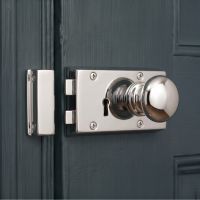 The "Addingley" Bright Chrome Rim Latch Set Mounted on a Wooden Blue Period Door - Digital Illustration