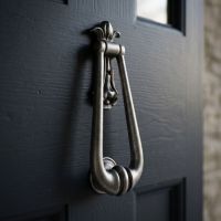 The "Addison Loop" Antique Pewter Door Knocker Shown on an Open Door to a Period Home - Digital Illustration The "Addison Loop" Antique Pewter Door Knocker Shown on an Open Door to a Period Home - Digital Illustration