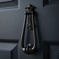 The "Addison Loop" Door Knocker on a Blue Door on the Front of a Home - Digital Illustration The "Addison Loop" Door Knocker on a Blue Door on the Front of a Home - Digital Illustration