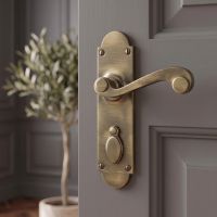 The "Amdega" 6½ inch Lever Handle with integrated keyhole Cover on a Grey Door - Digital Illustration 