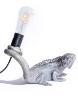 The "Arboreal Guardian" Iguana Wall Light in Silver Shown Laid on a Flat Surface instead of a Wall