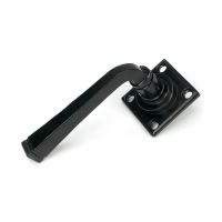 The "Arya" Unsprung Black Iron Door Handle Set Shown on its Side on a White Background  