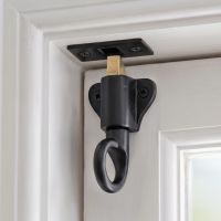 The "Aston" Black Iron Fanlight Catch with Two Keeps Mounted on a Wooden Door and Door Frame - Digital Illustration The "Aston" Black Iron Fanlight Catch with Two Keeps Mounted on a Wooden Door and Door Frame - Digital Illustration