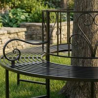 The "Averley" Circular Wrap-Around Garden Tree Bench in a Black Finish Around the Base of a Tree Close up of the Left Side- Digital Illustration The "Averley" Circular Wrap-Around Garden Tree Bench in a Black Finish Around the Base of a Tree Close up of the Left Side- Digital Illustration