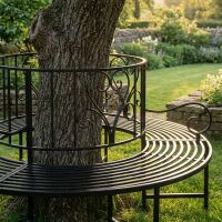 The "Averley" Circular Wrap-Around Garden Tree Bench in a Black Finish Around the Base of a Tree Close up of the Right Side- Digital Illustration The "Averley" Circular Wrap-Around Garden Tree Bench in a Black Finish Around the Base of a Tree Close up of the Right Side- Digital Illustration