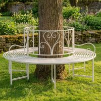 The "Averley" Circular Wrap-Around Garden Tree Bench in a Cream Finish Shown in a Sunny Garden Around the Base of a Tree - Digital Illustration The "Averley" Circular Wrap-Around Garden Tree Bench in a Cream Finish Shown in a Sunny Garden Around the Base of a Tree - Digital Illustration