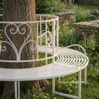 The "Averley" Circular Wrap-Around Garden Tree Bench in a Cream Finish Shown in a Sunny Garden Around the Base of a Tree Looking Close up at the Right Side- Digital Illustration The "Averley" Circular Wrap-Around Garden Tree Bench in a Cream Finish Shown in a Sunny Garden Around the Base of a Tree Looking Close up at the Right Side- Digital Illustration