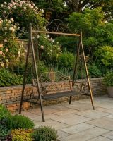 The "Blenheim" Ornate Arched Garden Swing Seat on a Sunny Garden Patio in a Black Finish - Digital Illustration The "Blenheim" Ornate Arched Garden Swing Seat on a Sunny Garden Patio in a Black Finish - Digital Illustration