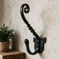 The "Coniston" Blacksmith Iron Coat Hook  Fitted on a Wall in a Hallway Entrance next to a Shelf - Digital Illustration