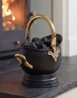 The "Countess" Black Iron & Polished Brass Coal Bucket Positioned on a Black Stone Fireplace - Digital Illustration The "Countess" Black Iron & Polished Brass Coal Bucket Positioned on a Black Stone Fireplace - Digital Illustration
