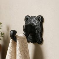The "Elnfield Park" Cast Iron Coat Hook on a Magnolia Coloured Wall in a Modern Home - Digital Illustration