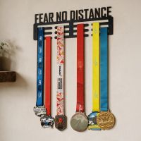 The "Fear No Distance" Sports Medal Hanger on a Cream Wall Shown From a Low Angle in a Home - Digital Illustration
