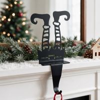 The "Gingersnap" Elf Stocking Holder Placed on a Mantelpiece next to Christmas Decor in a Modern Home - Digital Illustration The "Gingersnap" Elf Stocking Holder Placed on a Mantelpiece next to Christmas Decor in a Modern Home - Digital Illustration