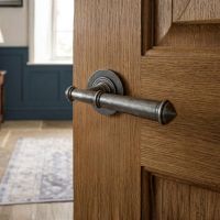 The "Hadley Gardens" Antique Pewter Unsprung Lever Door Handle on Rose on a Door in a Traditional Home - Digital Illustration The "Hadley Gardens" Antique Pewter Unsprung Lever Door Handle on Rose on a Door in a Traditional Home - Digital Illustration