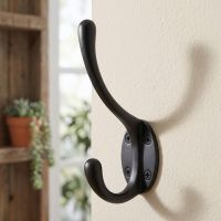 The "Hastings" Black Iron Coat Hook on a Magnolia Coloured Internal Wall - Digital Illustration 