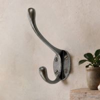 The "Hastings" Natural Iron Coat Hook on a Cream Coloured Wall next to a Shelf - Digital Illustration The "Hastings" Natural Iron Coat Hook on a Cream Coloured Wall next to a Shelf - Digital Illustration