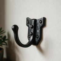 The "Holmcliffe" Single Blacksmith Iron Hook in a Well Lit Hallway Entrance - Digital Illustration 