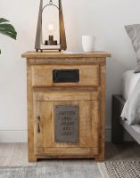 The "Jupiter Iron Works" Industrial Bedside Cabinet Positioned Next to a Bed in a Contemporary Bedroom with a Lamp Positioned Above - Digital Illustration The "Jupiter Iron Works" Industrial Bedside Cabinet Positioned Next to a Bed in a Contemporary Bedroom with a Lamp Positioned Above - Digital Illustration