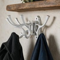 The "Kynaston Avenue" Swivel Hook in White Displayed Attached to a White Wall with two Jackets Hung on it - Digital Illustration The "Kynaston Avenue" Swivel Hook in White Displayed Attached to a White Wall with two Jackets Hung on it - Digital Illustration