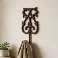 The "Lady Adelaid" Cast Iron Hook Mounted on a Sand Coloured Interior wall - Digital Illustration